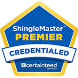 ShingleMaster Premier Credentialed roofer badge with blue shield design and gold border, certifying roofing contractor credentials
